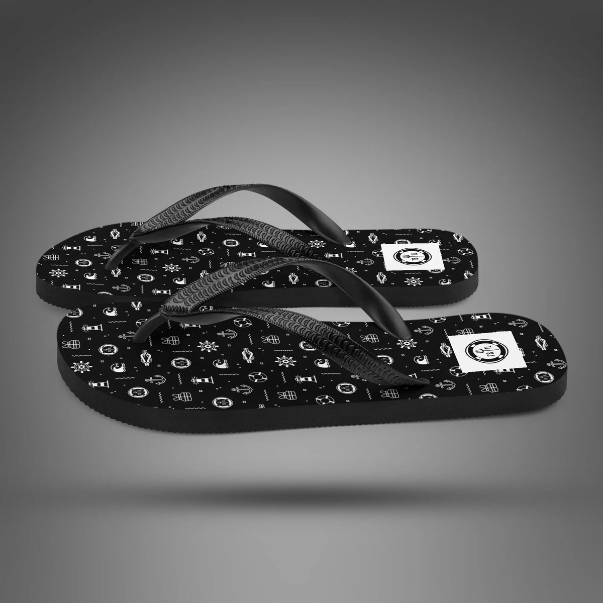 Beach Activity flip flops in side view, black soles with a white nautical icon print