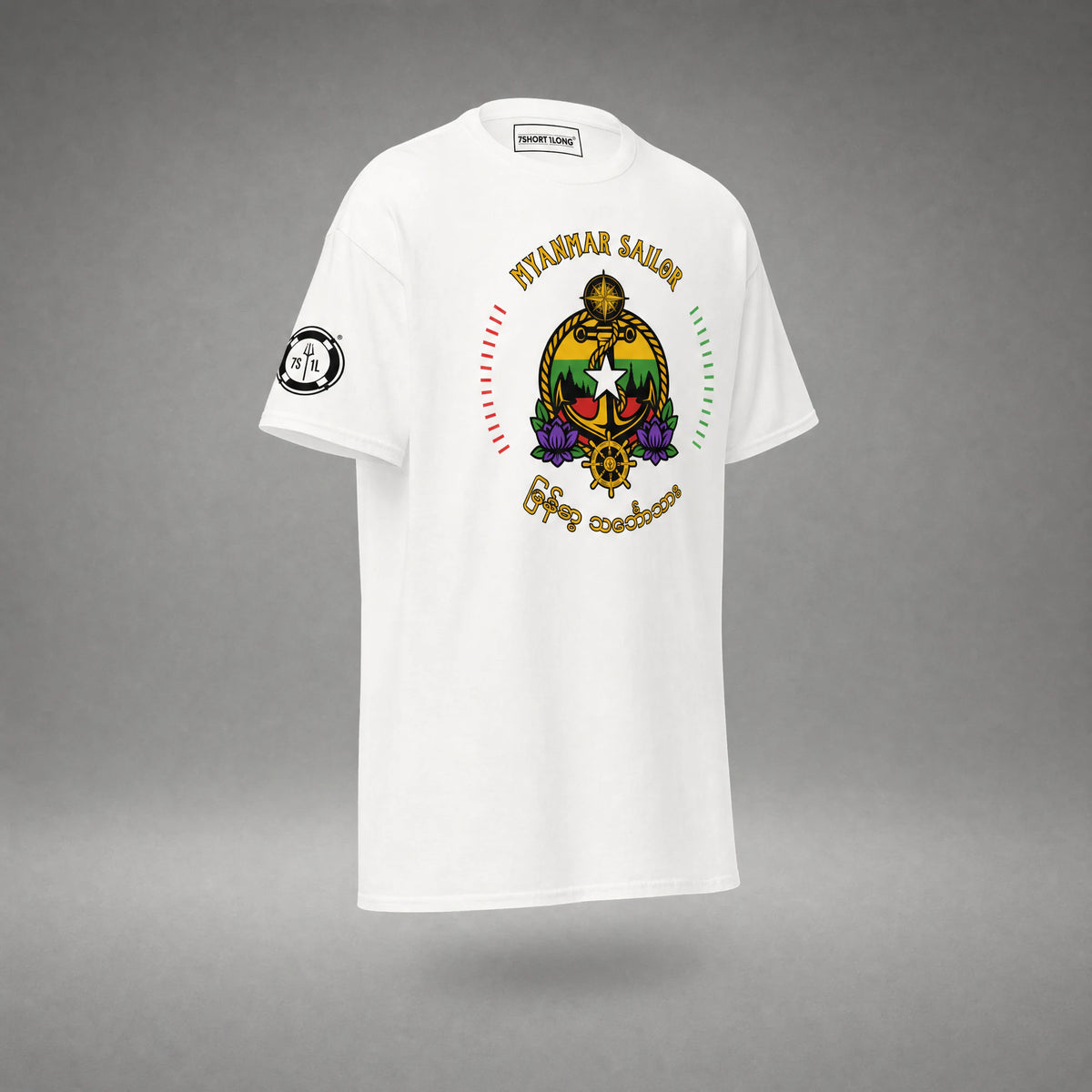 Angled view of the white Myanmar Sailor T-shirt: white star and anchor crest, purple lotus flowers and Burmese script below.