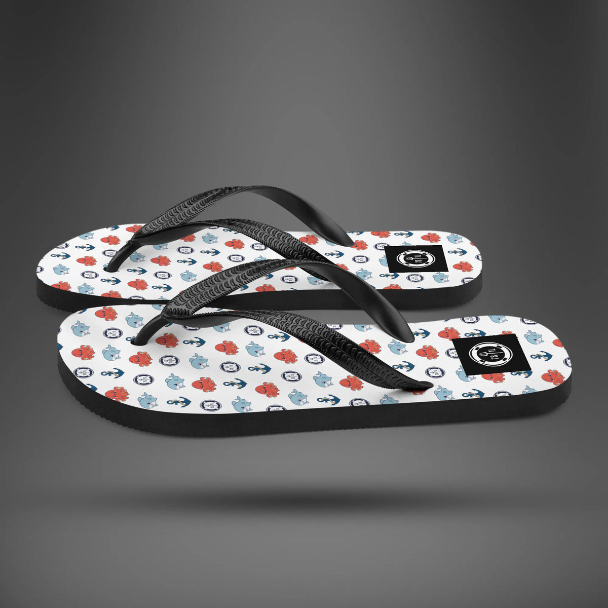 Sea Life anchor flip flops in side view, white soles with red and blue anchor and sea life icons
