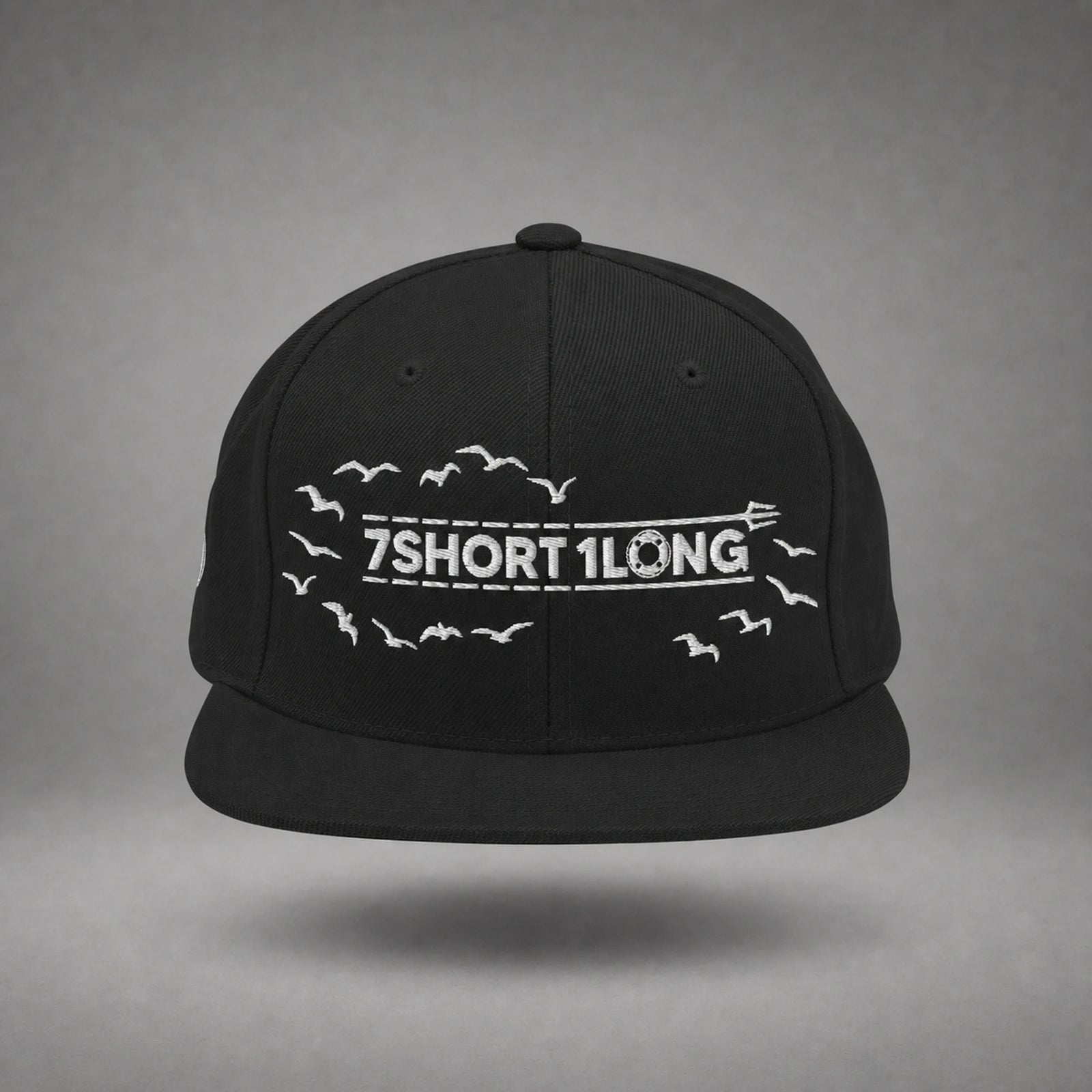 Black Seagulls snapback cap shown from the front in a gray floating studio.