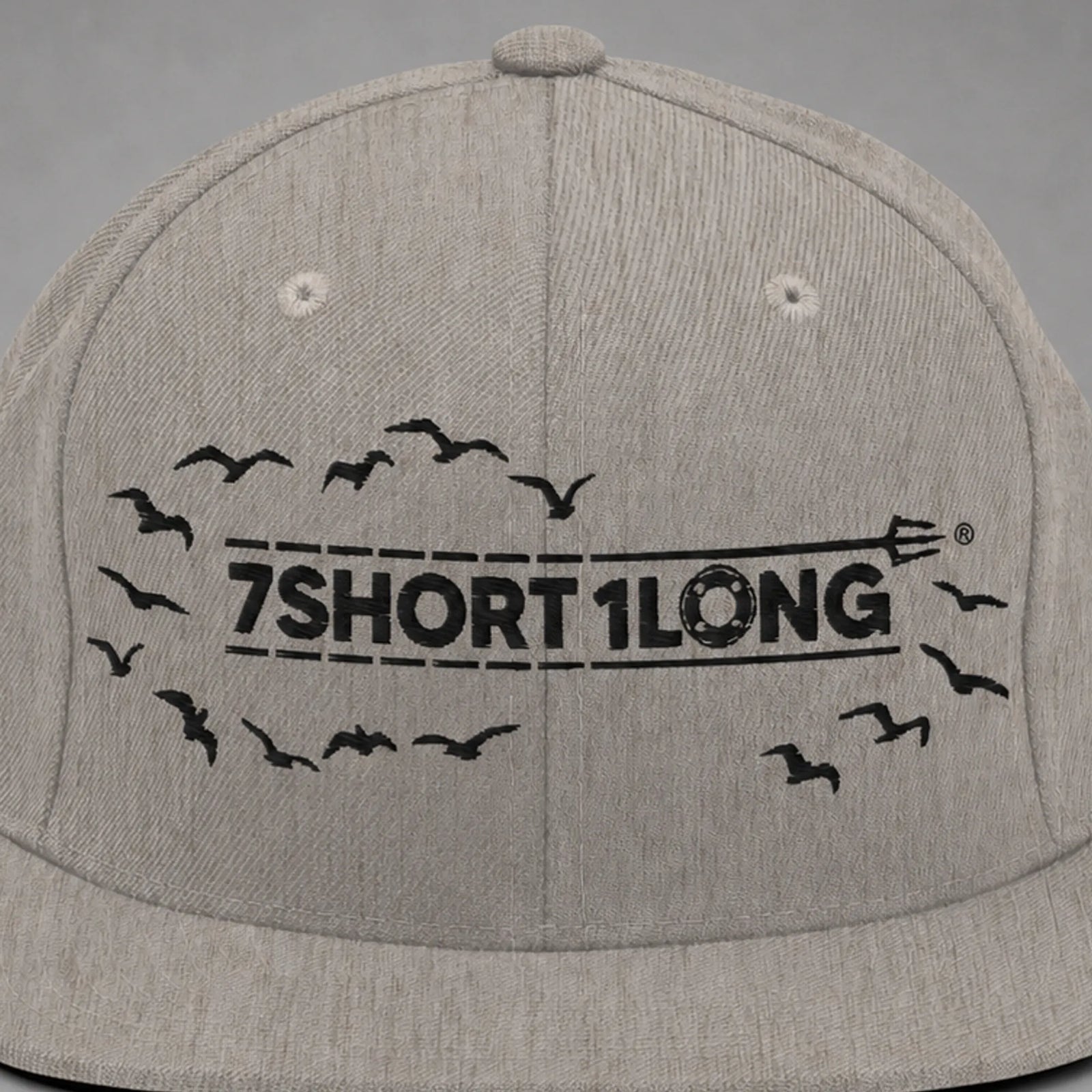 Close view of the Seagulls embroidery on a heather grey snapback cap.