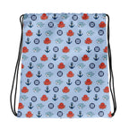 bag with nautical pattern featuring octopuses, anchors, and baby sharks on a light blue background.