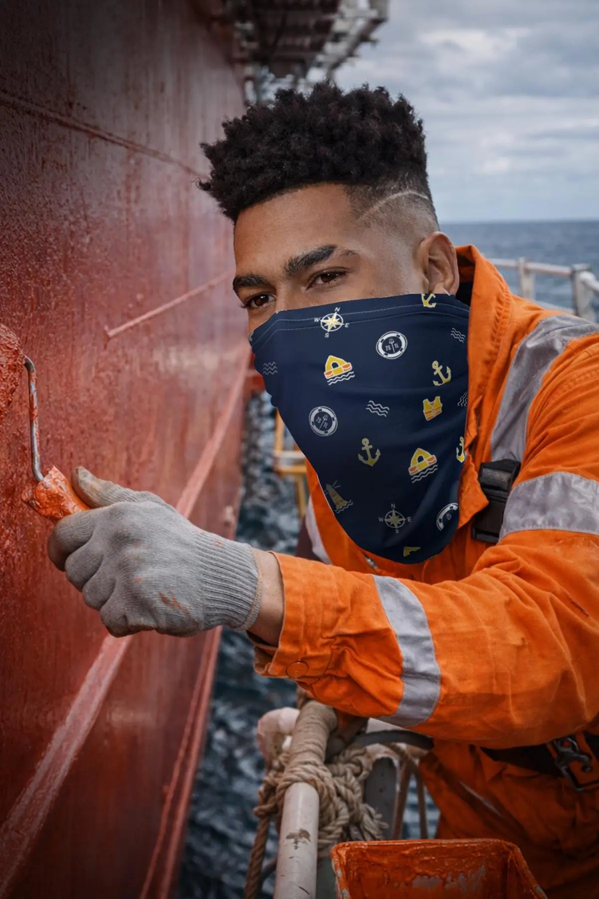 Deck maintanace done by a crewmember wearing ppe facemask