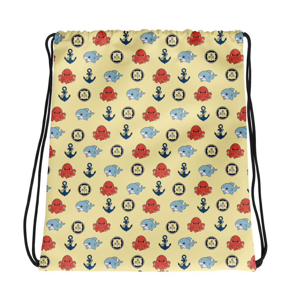 Drawstring bag with nautical pattern featuring octopuses, anchors, and shark on a sunny yellow background.