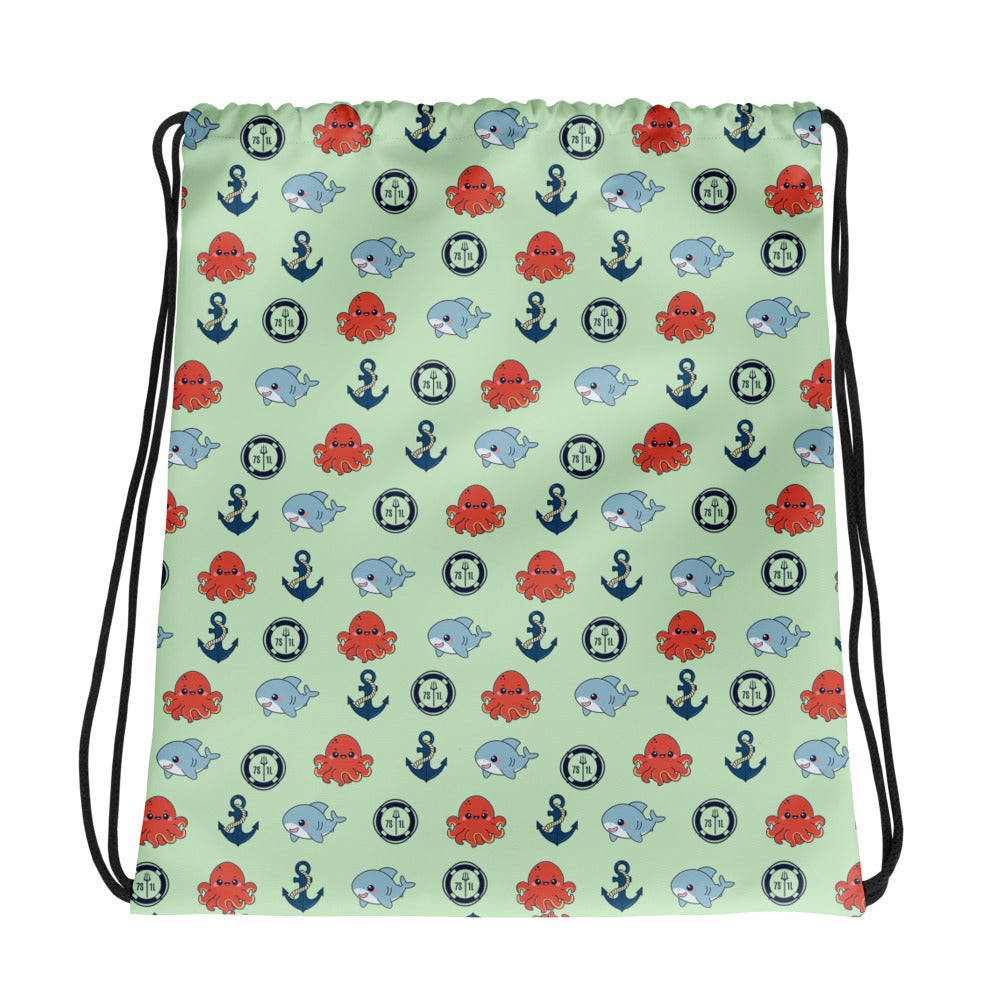Drawstring bag with nautical pattern featuring octopuses, whales, and anchors on a light green background.