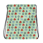 Drawstring bag with nautical pattern featuring octopuses, whales, and anchors on a light green background.