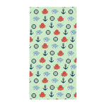 Children's towel with nautical pattern on a light green background