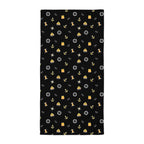 Black towel with yellow and white maritime pattern on a white background