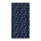 Navy blue towel with nautical pattern on a white background