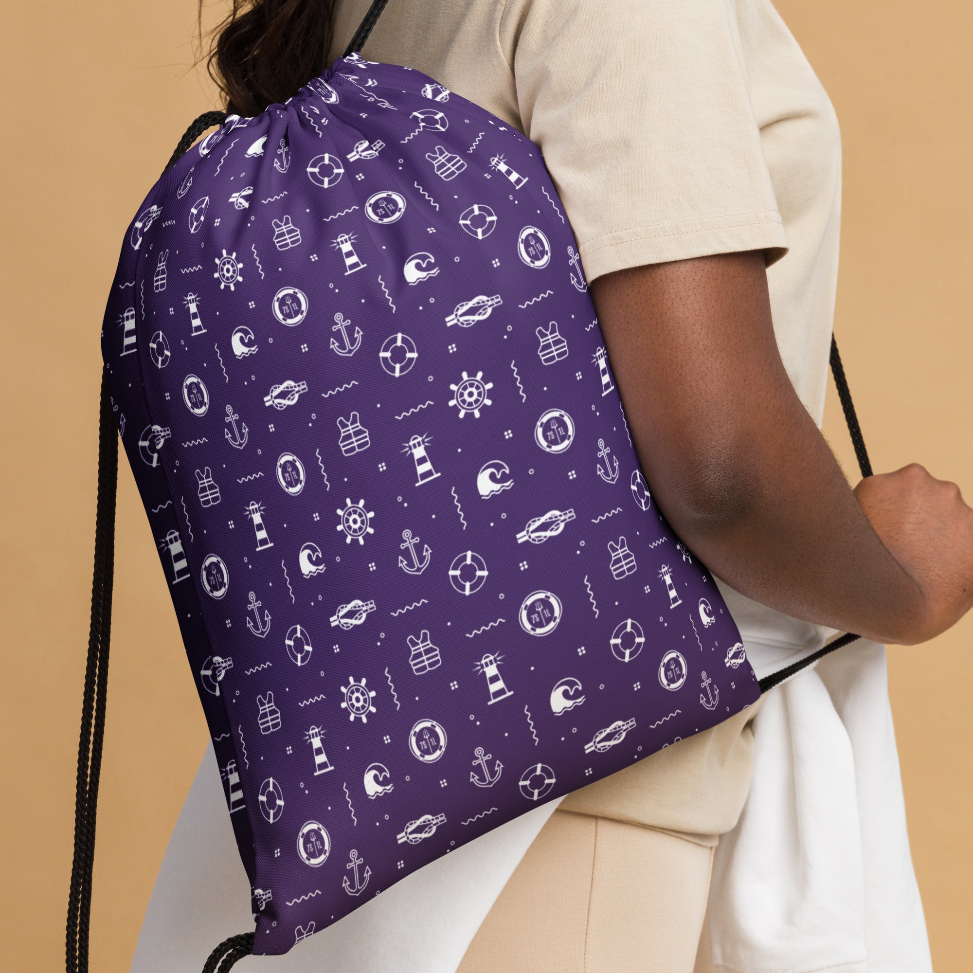 Person wearing a purple day bag with  cruise ship patterns on a beige background