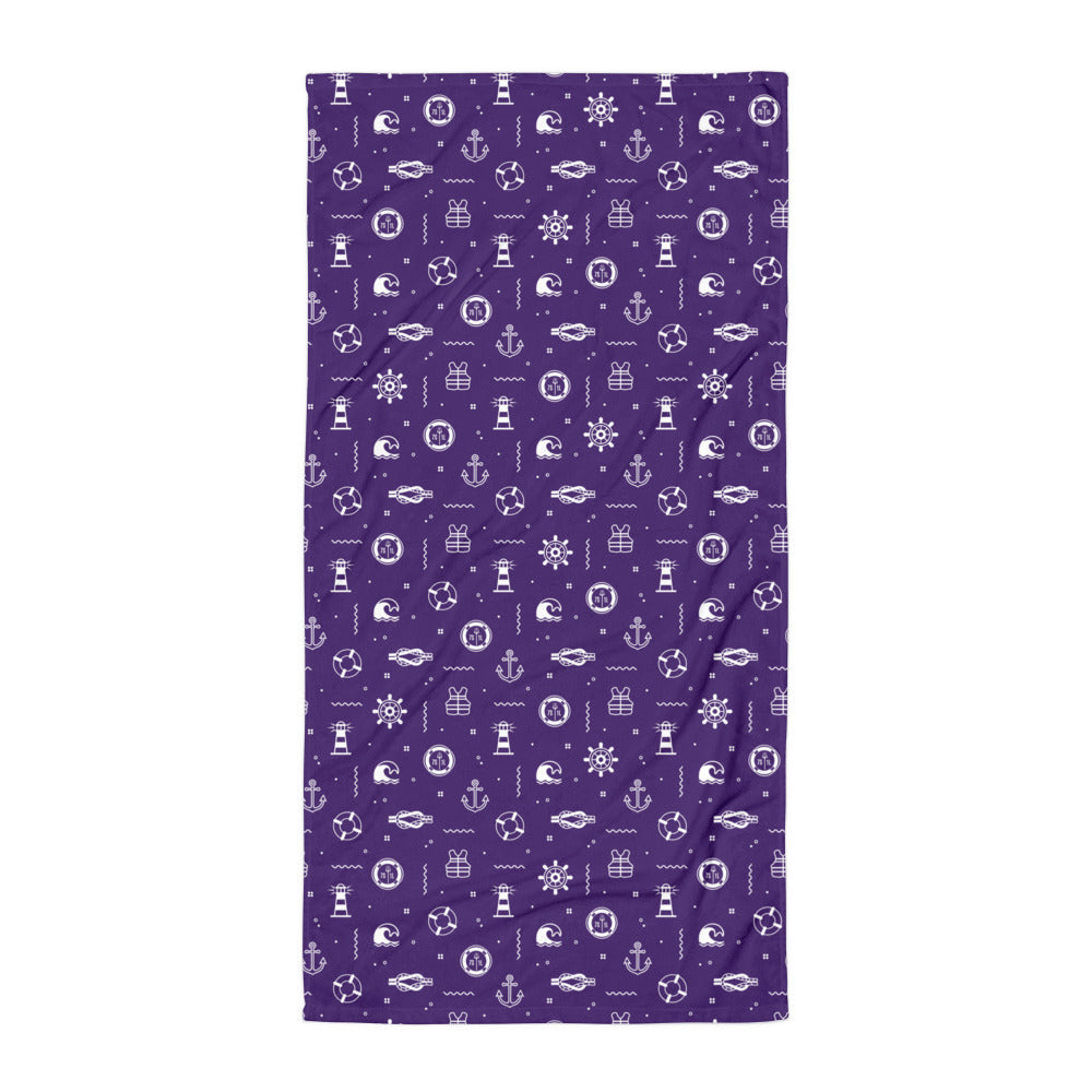 Purple towel with white maritime-themed icons on a white background