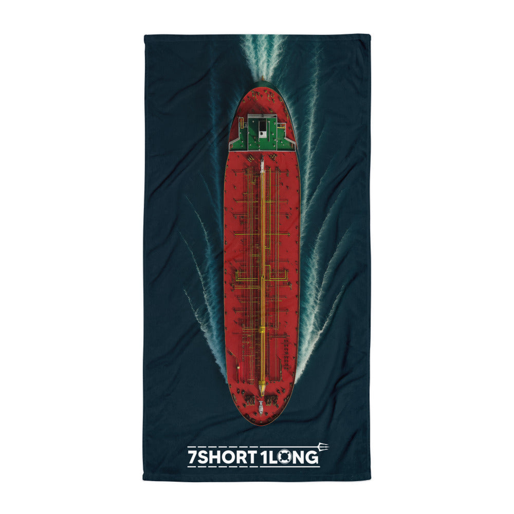 Towel with a red and green Tanker design on a dark blue ocean, featuring '7 Short 1 Long' branding.
