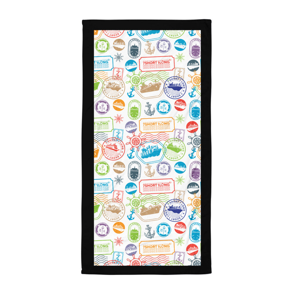 Towel with colorful travel-themed stamps pattern on a white background