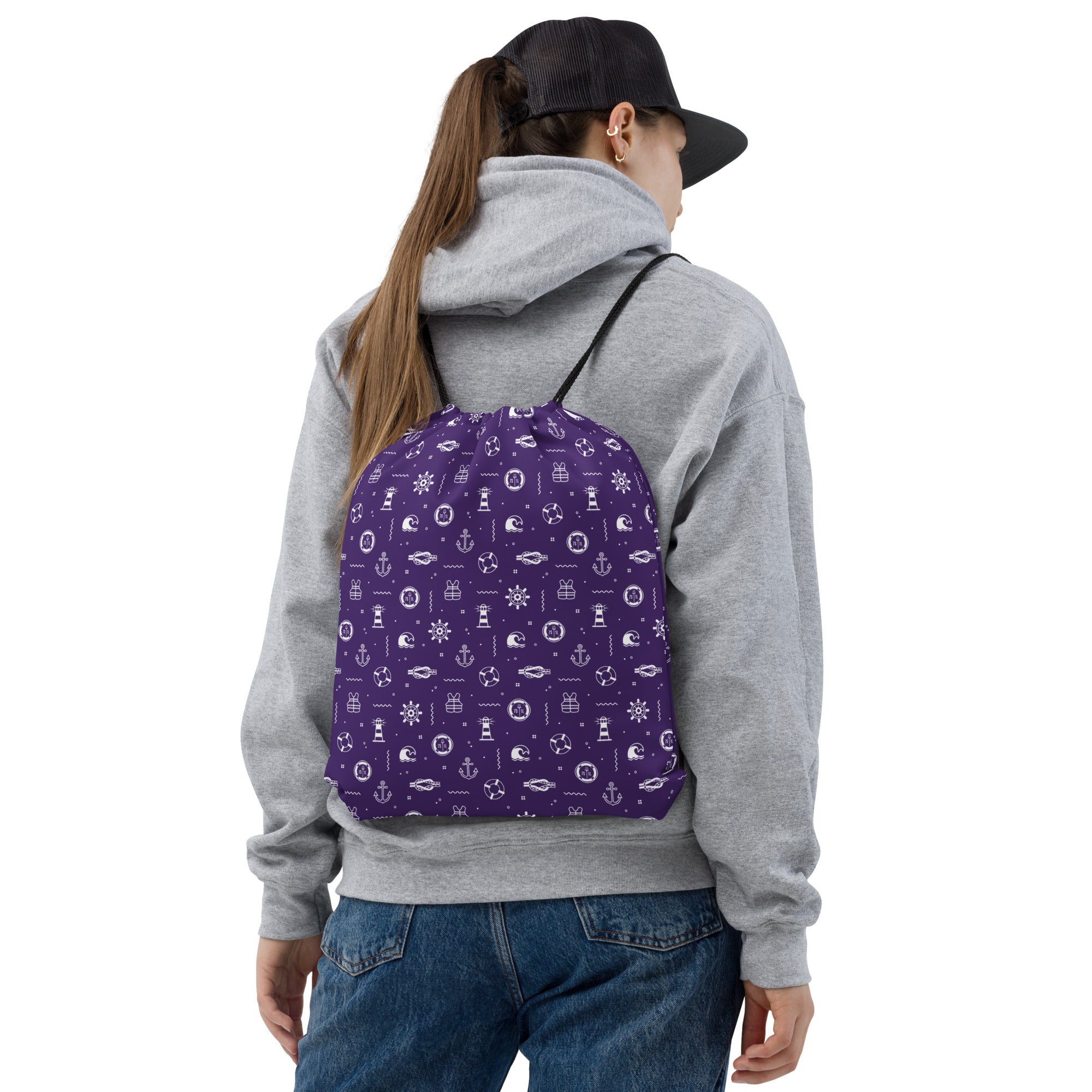 Person wearing apurple backpack with white nautical patterns on a cruise ship