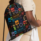 Person holding a colorful drawstring bag with various patterns on a beige background