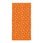 Orange towel with nautical pattern on a white background