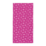 Pink towel with white icons of the sea on a white background