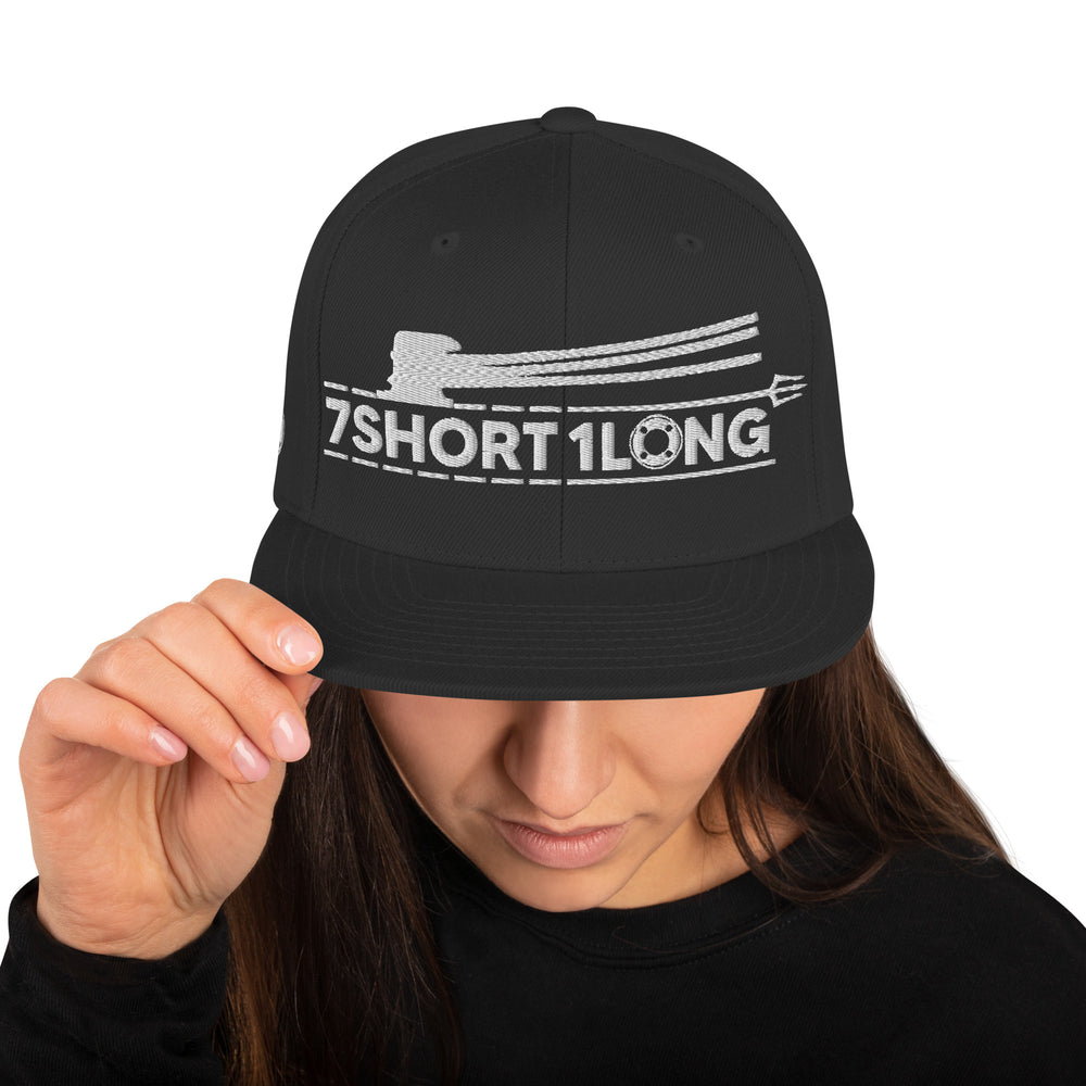 Black Snapback cap with 7-Shot-One-Long logo and mooring lines design, inspired by ship mooring operations and bringing lines ashore, adjustable snapback closure.