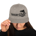 Beige Snapback cap with 7-Shot-One-Long logo and mermaid design, inspired by maritime folklore and seafaring culture.