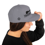 Snapback cap with 7-Shot-One-Long logo and mooring lines design, inspired by ship mooring operations and bringing lines ashore, adjustable snapback closure.