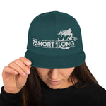 Green Snapback cap with 7-Shot-One-Long logo and mermaid design, inspired by maritime folklore and seafaring culture.