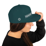 Green Snapback cap with 7-Shot-One-Long logo and mermaid design, inspired by maritime folklore and seafaring culture.