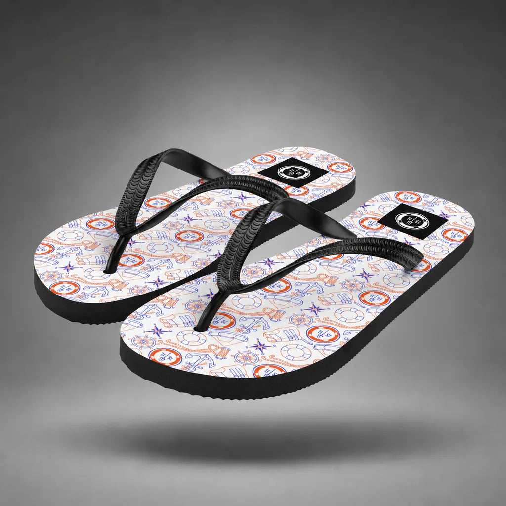 Pair of red, white, and blue Coast Guard flip-flops with Coast Guard maritime pattern, floating above a grey studio floor with a soft shadow.