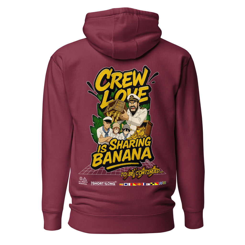 Maroon unisex cotton-heritage Crew Humor Hoodie by 7SHORT1LONG® with playful "Crew Love Is Sharing Banana" graphic on the back.