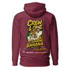 Maroon unisex cotton-heritage Crew Humor Hoodie by 7SHORT1LONG® with playful "Crew Love Is Sharing Banana" graphic on the back.