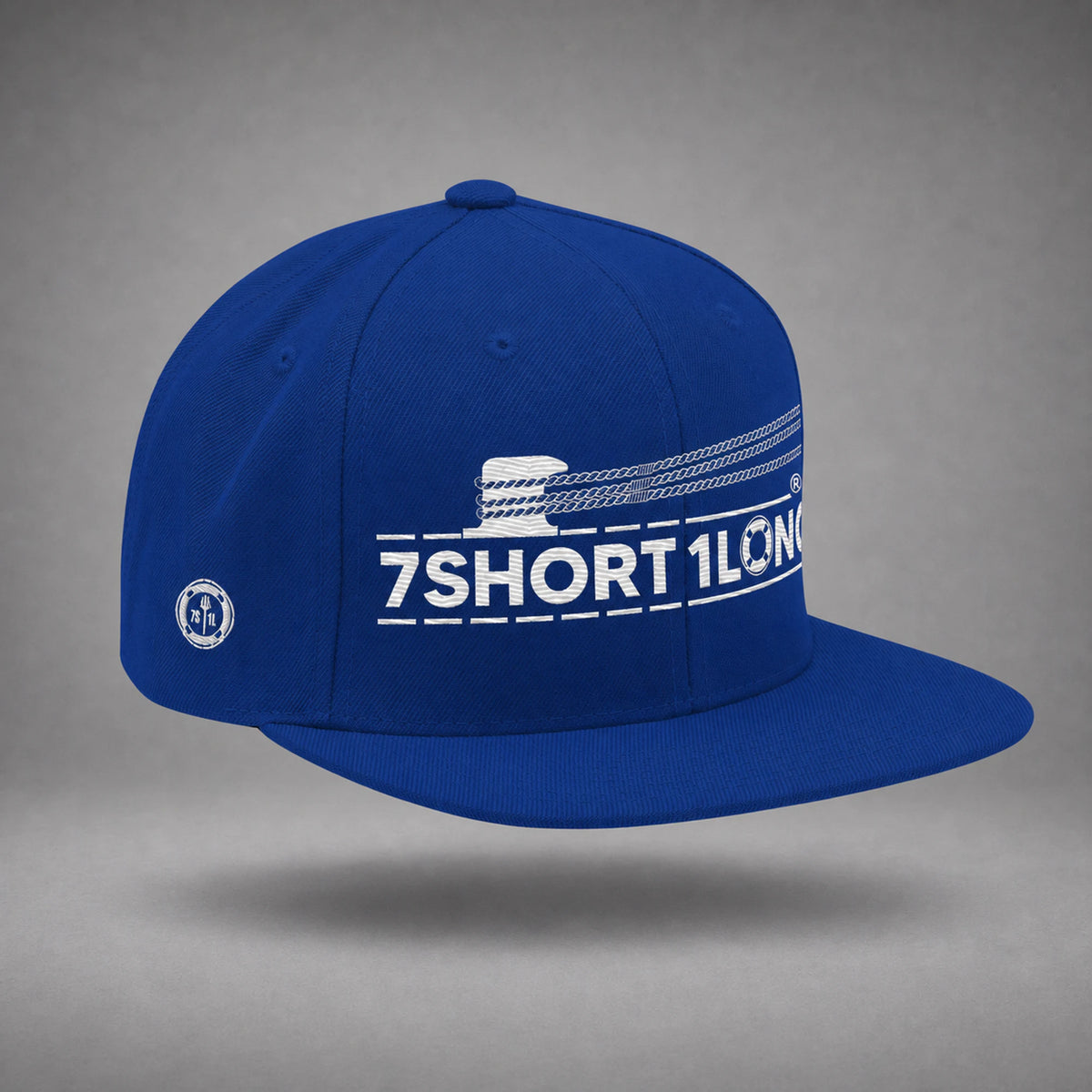 Royal Blue Deck Hand rope and signal snapback cap shown from the left side in a gray floating studio.