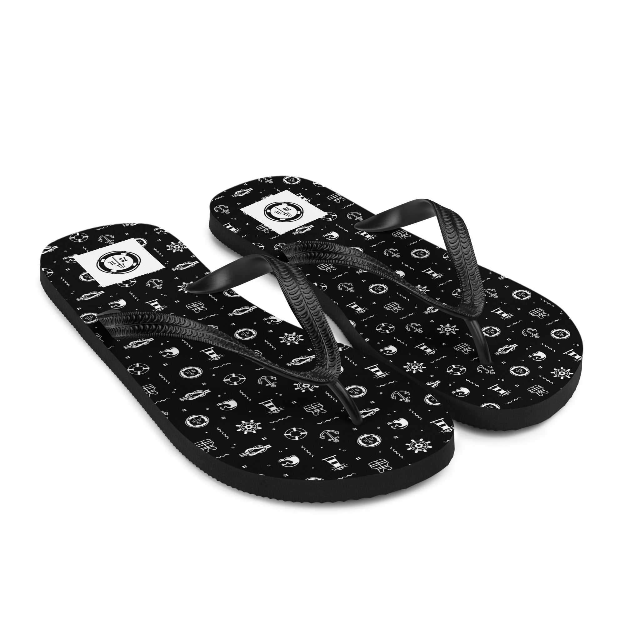 Black nautical-themed flip flops from 7SHORT1LONG® featuring maritime icons, ideal for beach and seaside activities.