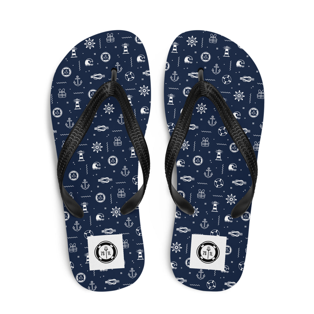 Navy blue flip-flops with maritime pattern on a white background