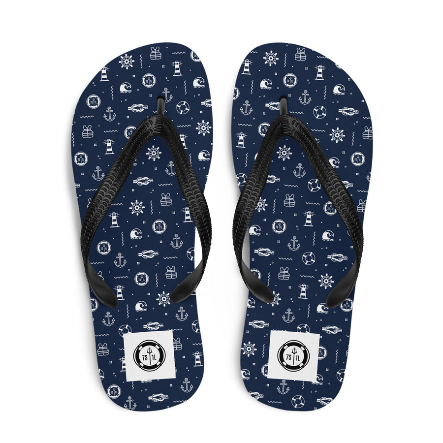 Navy blue flip-flops with maritime pattern on a white background