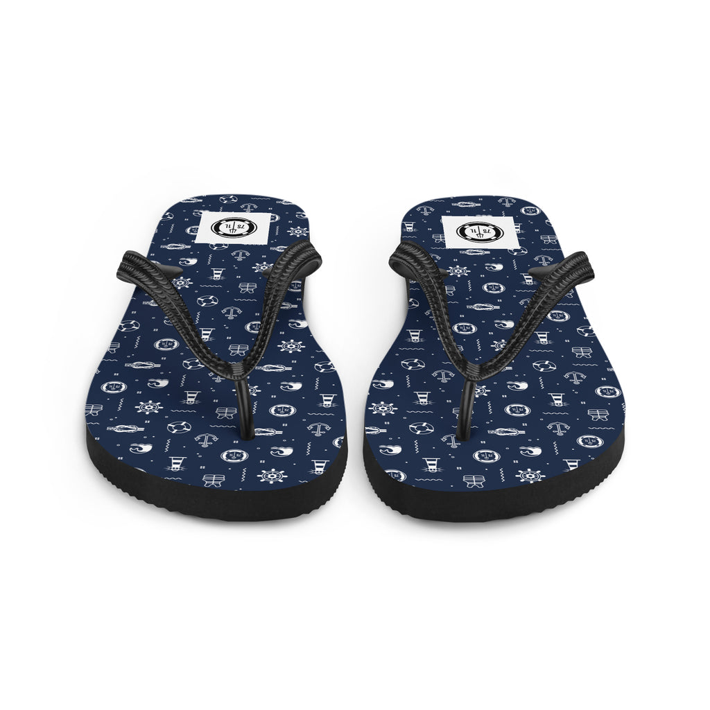 Pair of navy blue flip-flops with white pattern on a white background