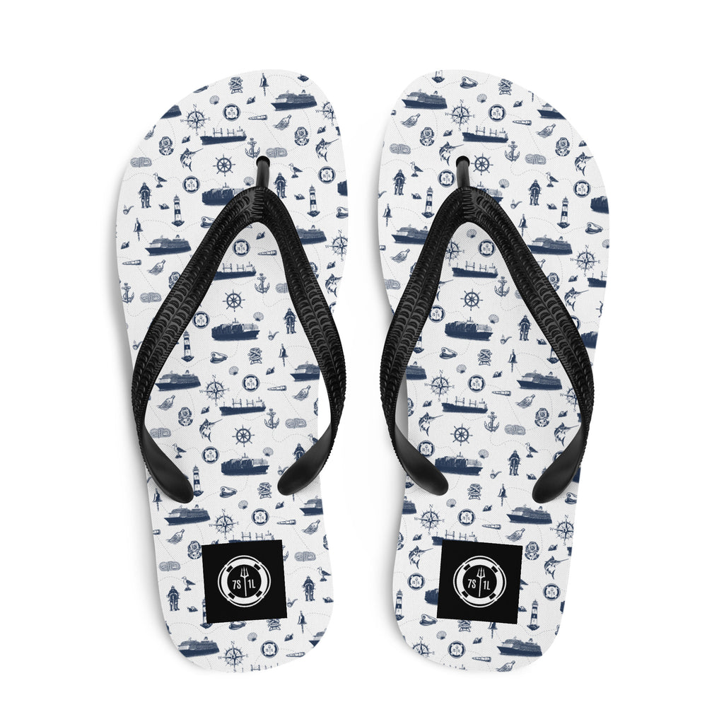 White and navy Coastal Cruise Flip Flops by 7SHORT1LONG® with nautical pattern, perfect for seaside and cruise wear.