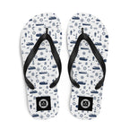 White and navy Coastal Cruise Flip Flops by 7SHORT1LONG® with nautical pattern, perfect for seaside and cruise wear.