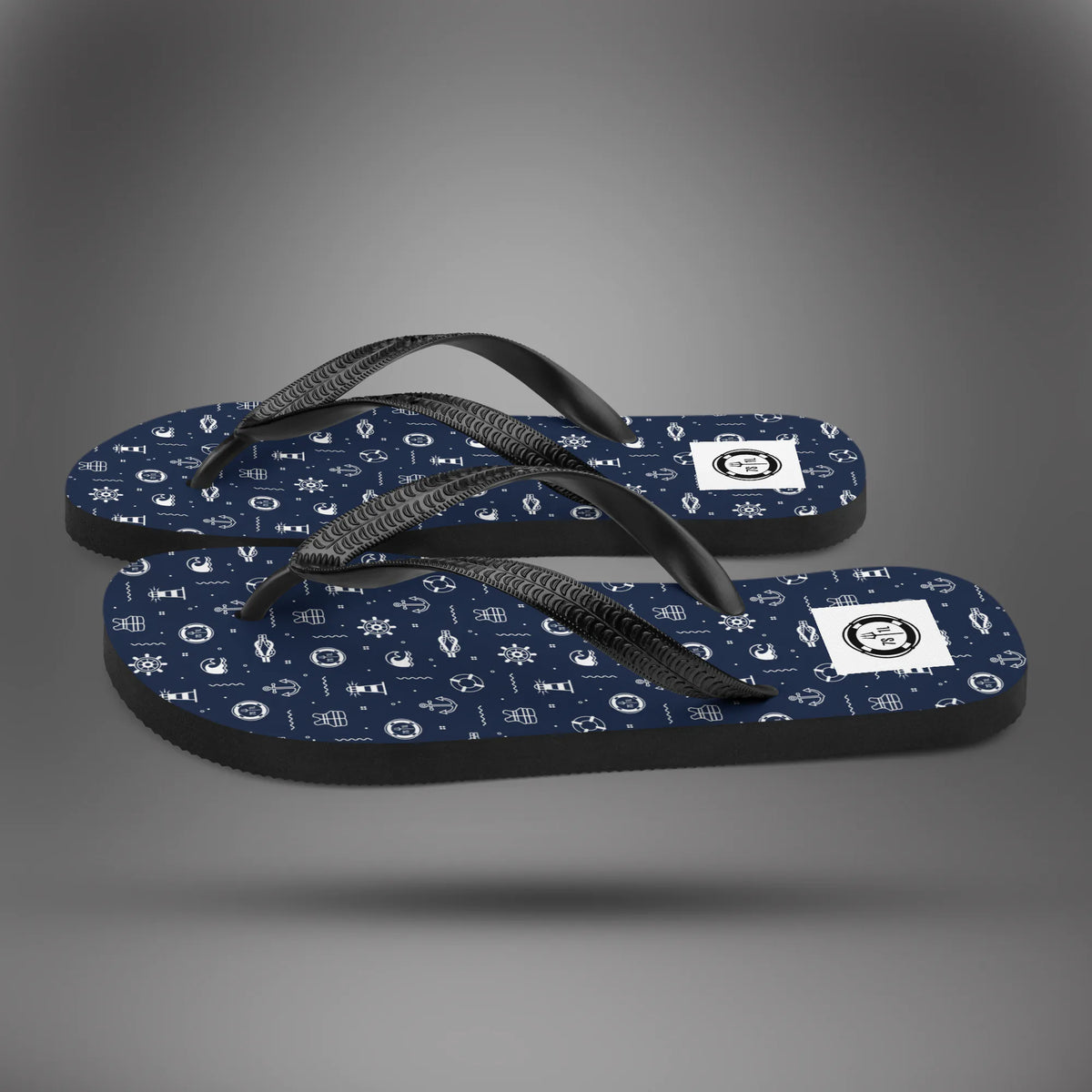 Nautical Icon flip flops in side view, navy soles with a white nautical icon print