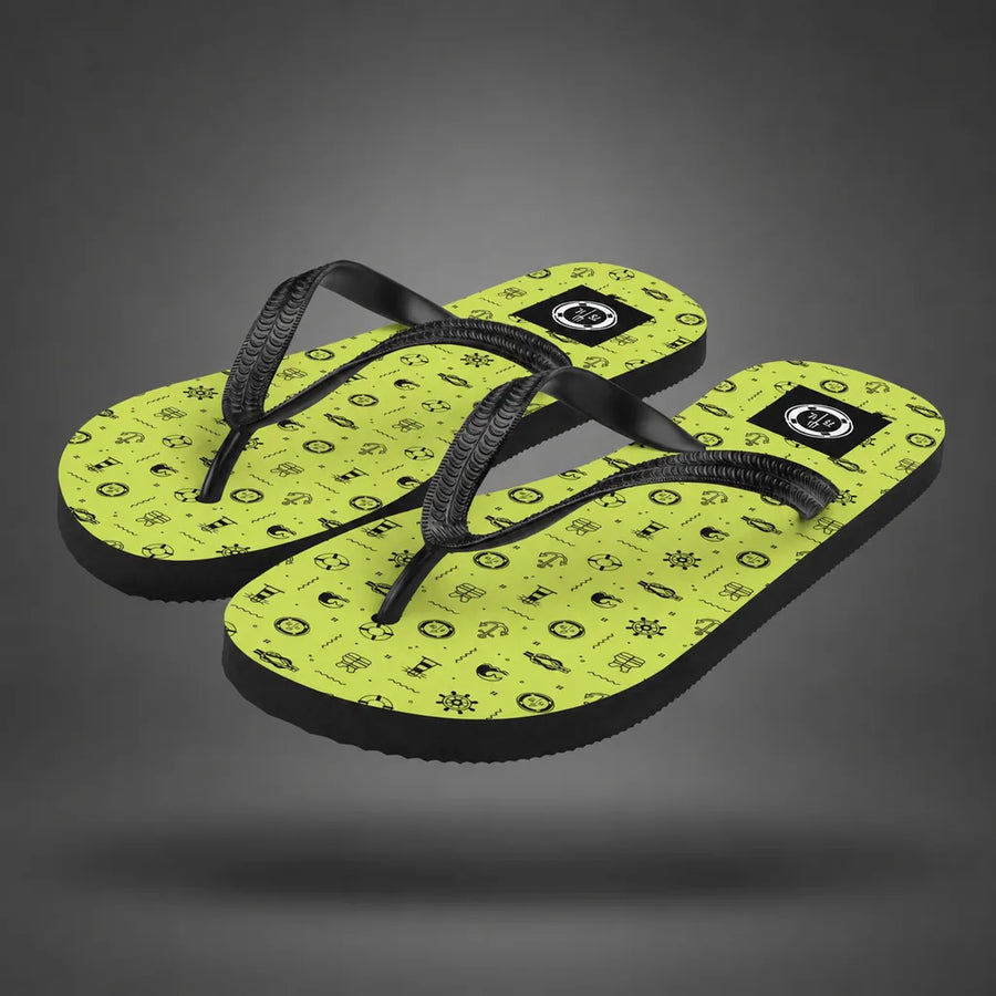 Pair of lemon green Nautical Summer flip-flops with ocean icon pattern, floating above a grey studio floor with a soft shadow.