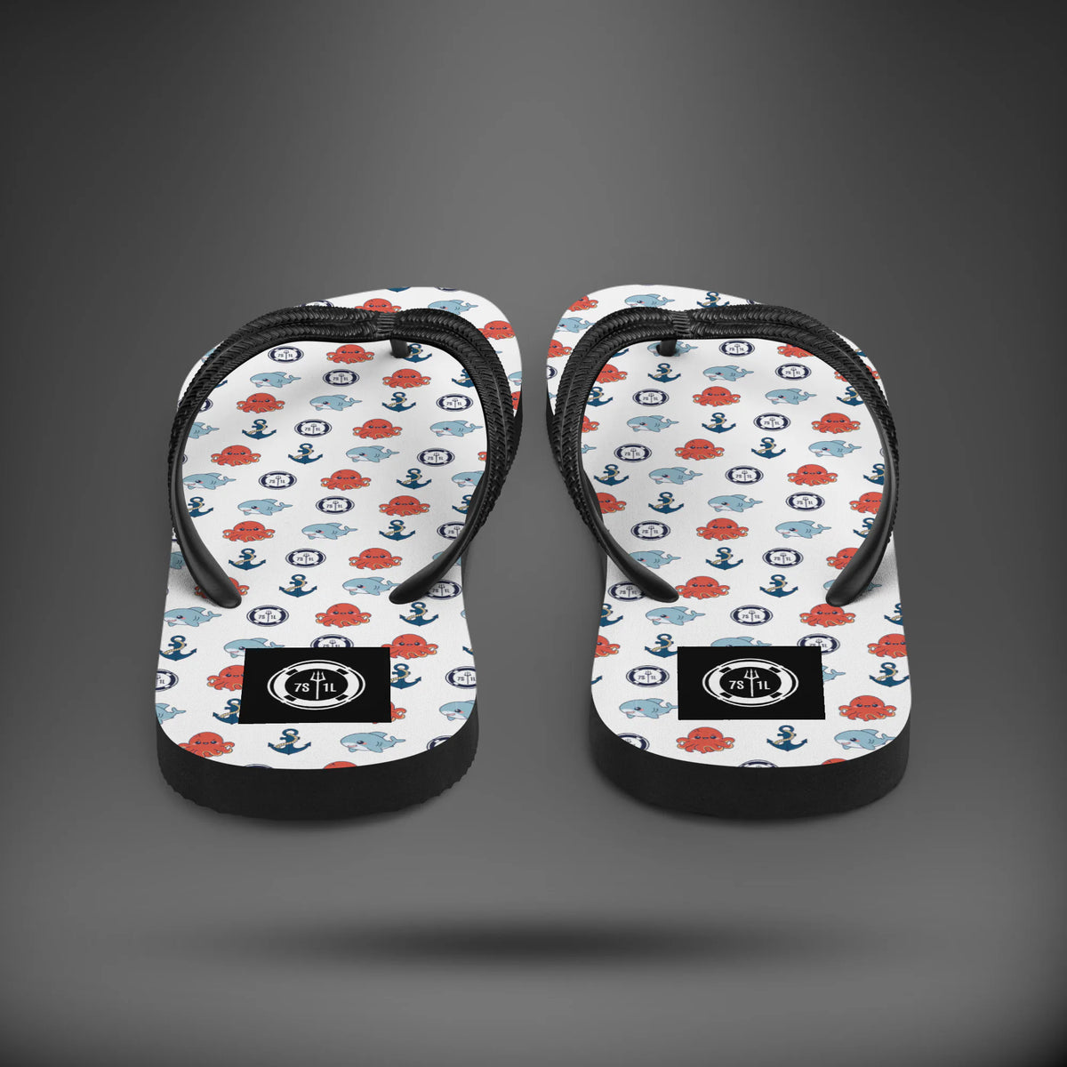 Sea Life anchor flip flops seen from the heel, white soles with red and blue sea life icons and black straps