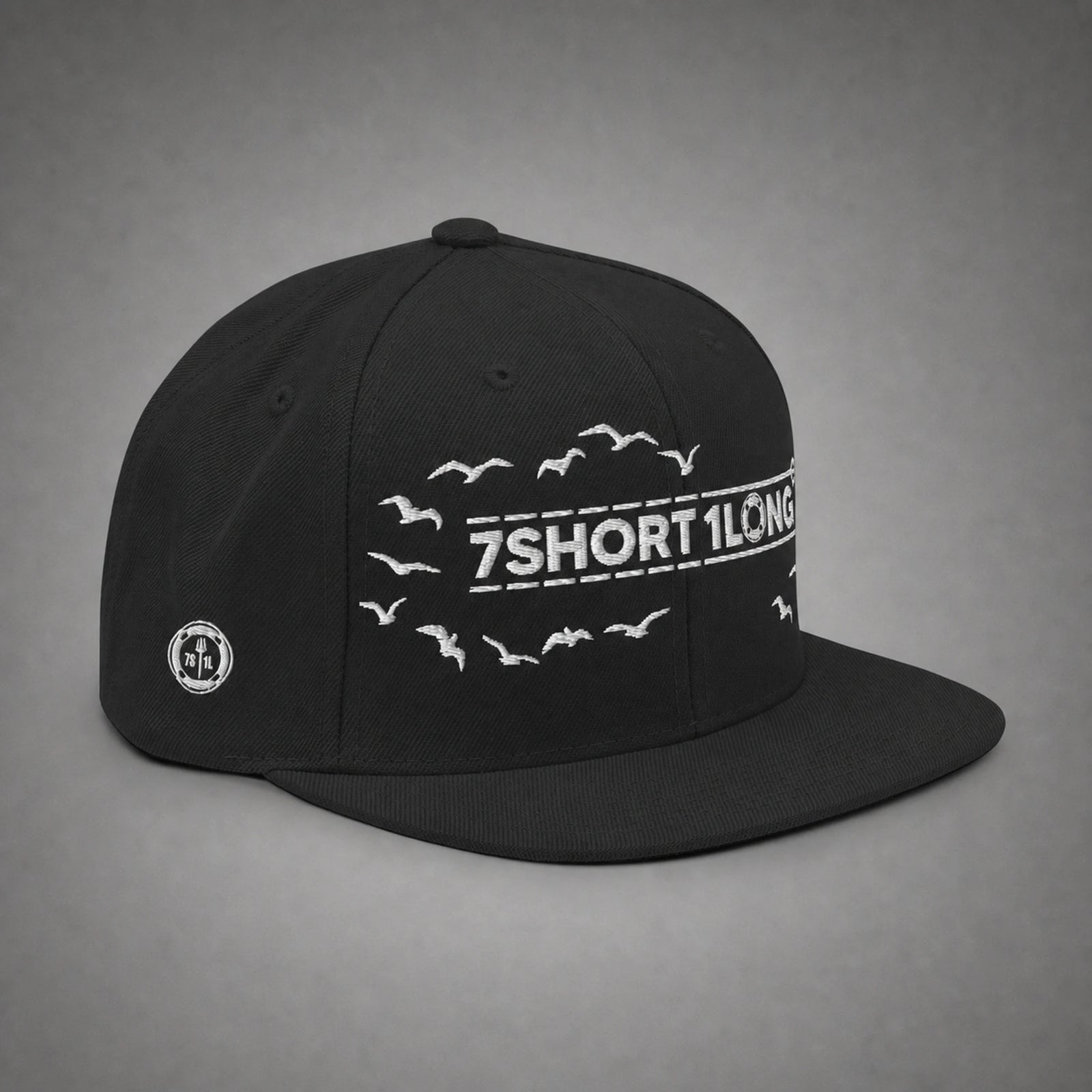 Black Seagulls snapback cap shown from the left side in a gray floating studio.