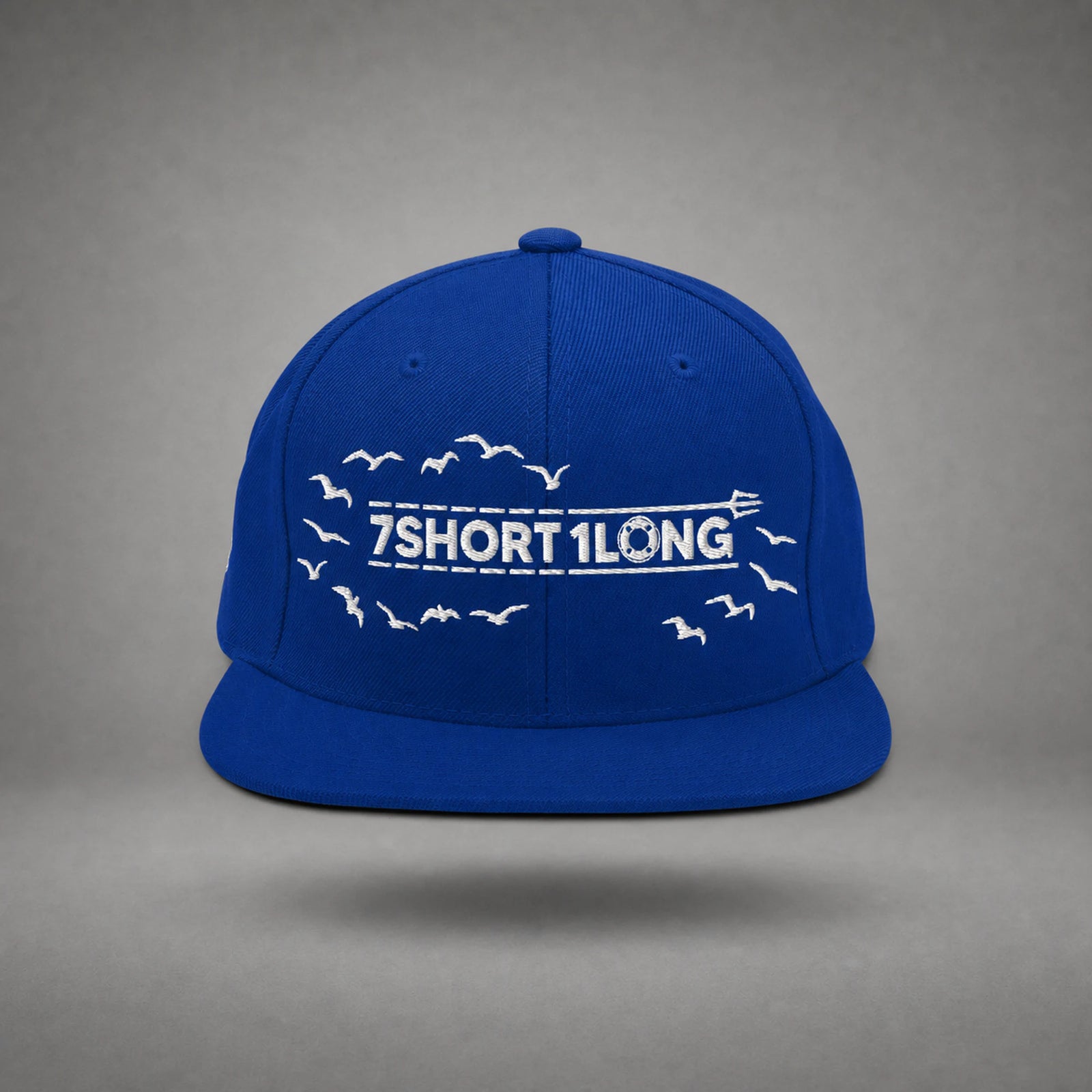 Royal Blue Seagulls snapback cap shown from the front in a gray floating studio.