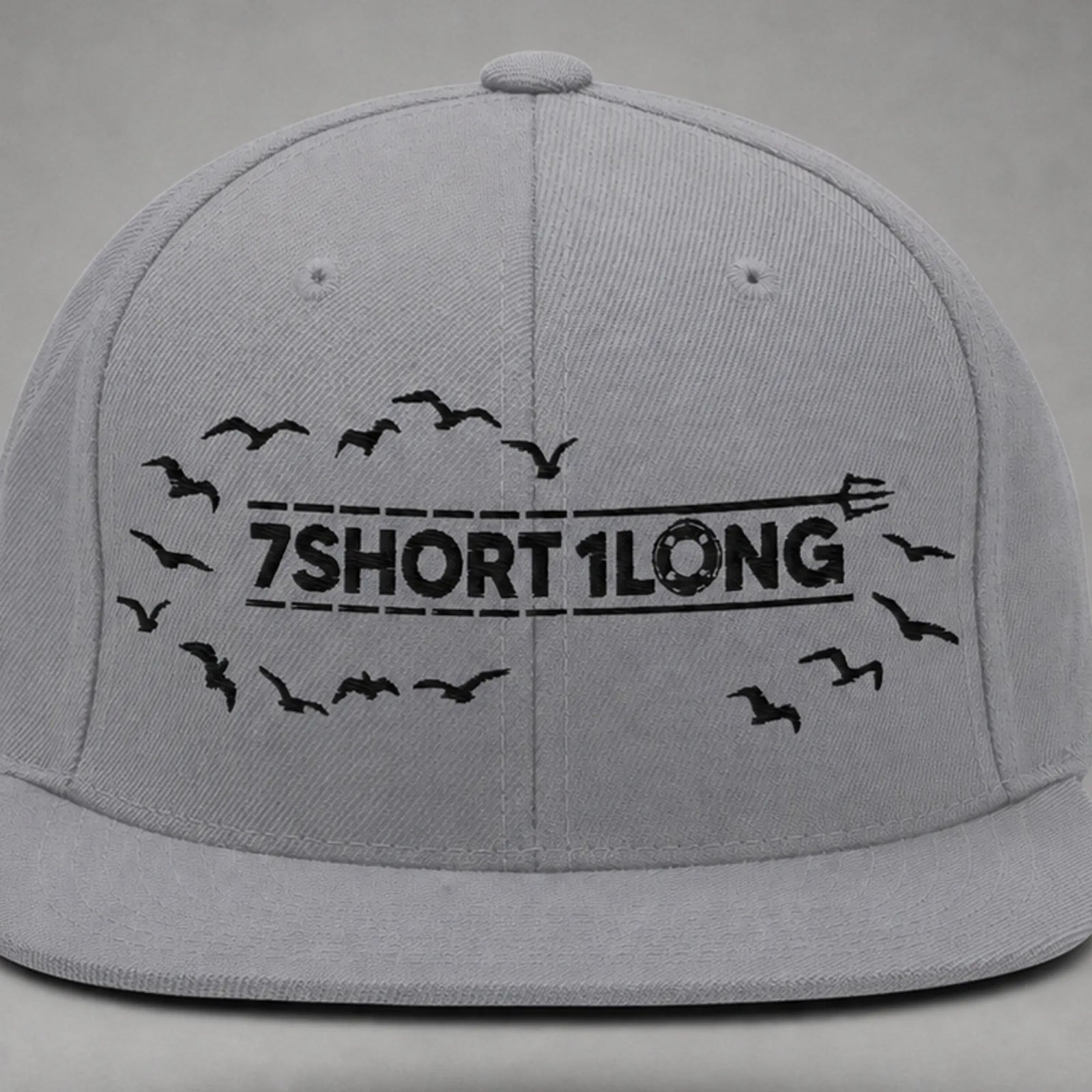 Close view of the Seagulls embroidery on a silver snapback cap.