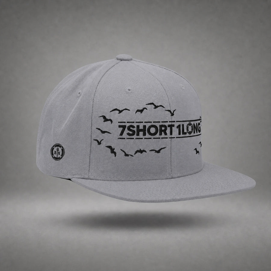 Silver Seagulls snapback cap shown from the left side in a gray floating studio.