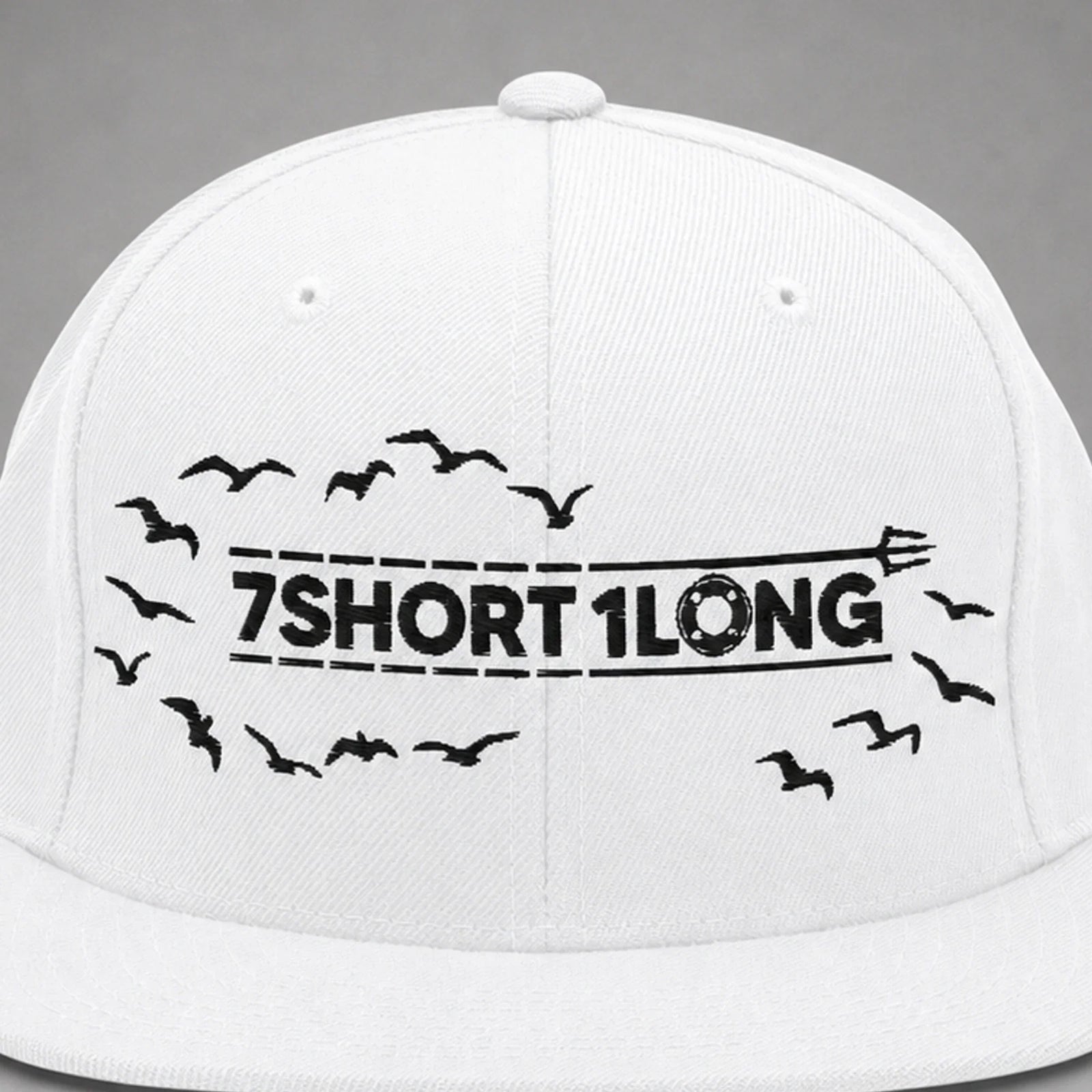 Close view of the Seagulls embroidery on a white snapback cap.