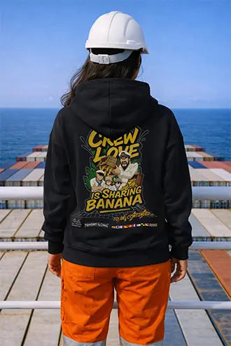 Seafarer wearing a black crew hoodie on a cargo ship