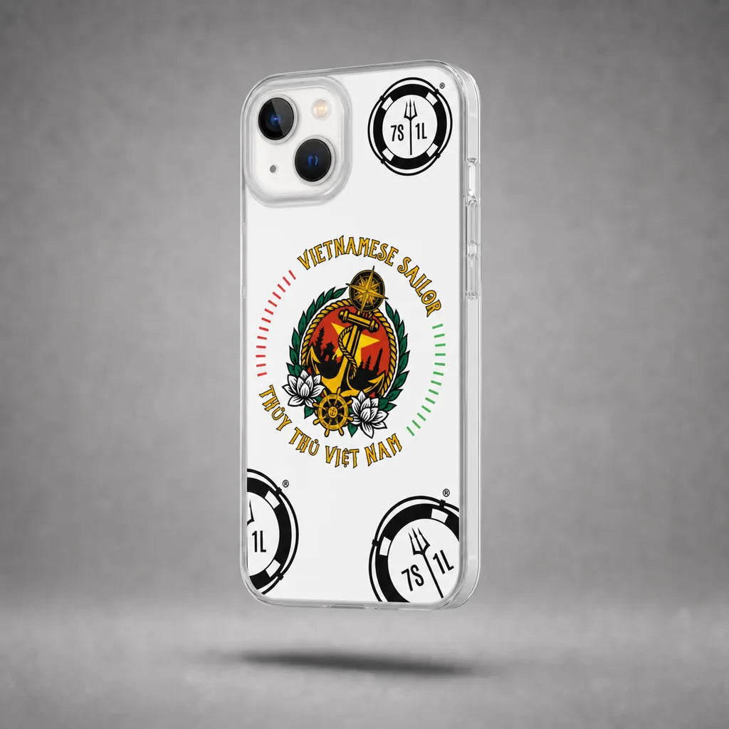 Clear Vietnamese Sailor case for iPhone 13 with maritime anchor artwork, floating above a grey studio floor with a soft shadow.
